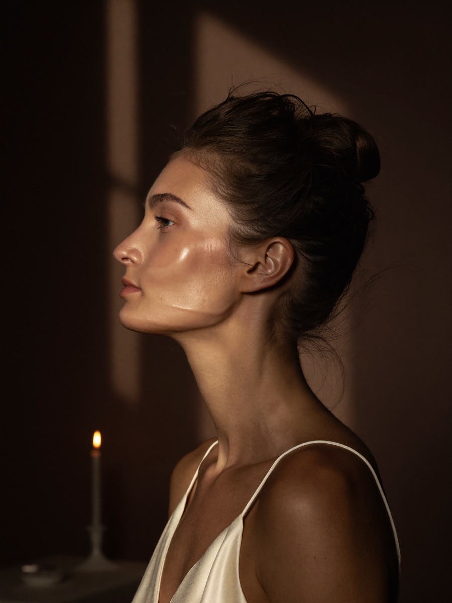 A woman in profile with lifted cheekbones and a defined jawline after the Bridal Sculpt